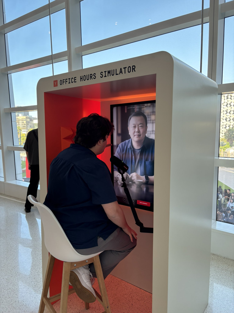 Eve Bouffard in YC Office Hours Simulator booth